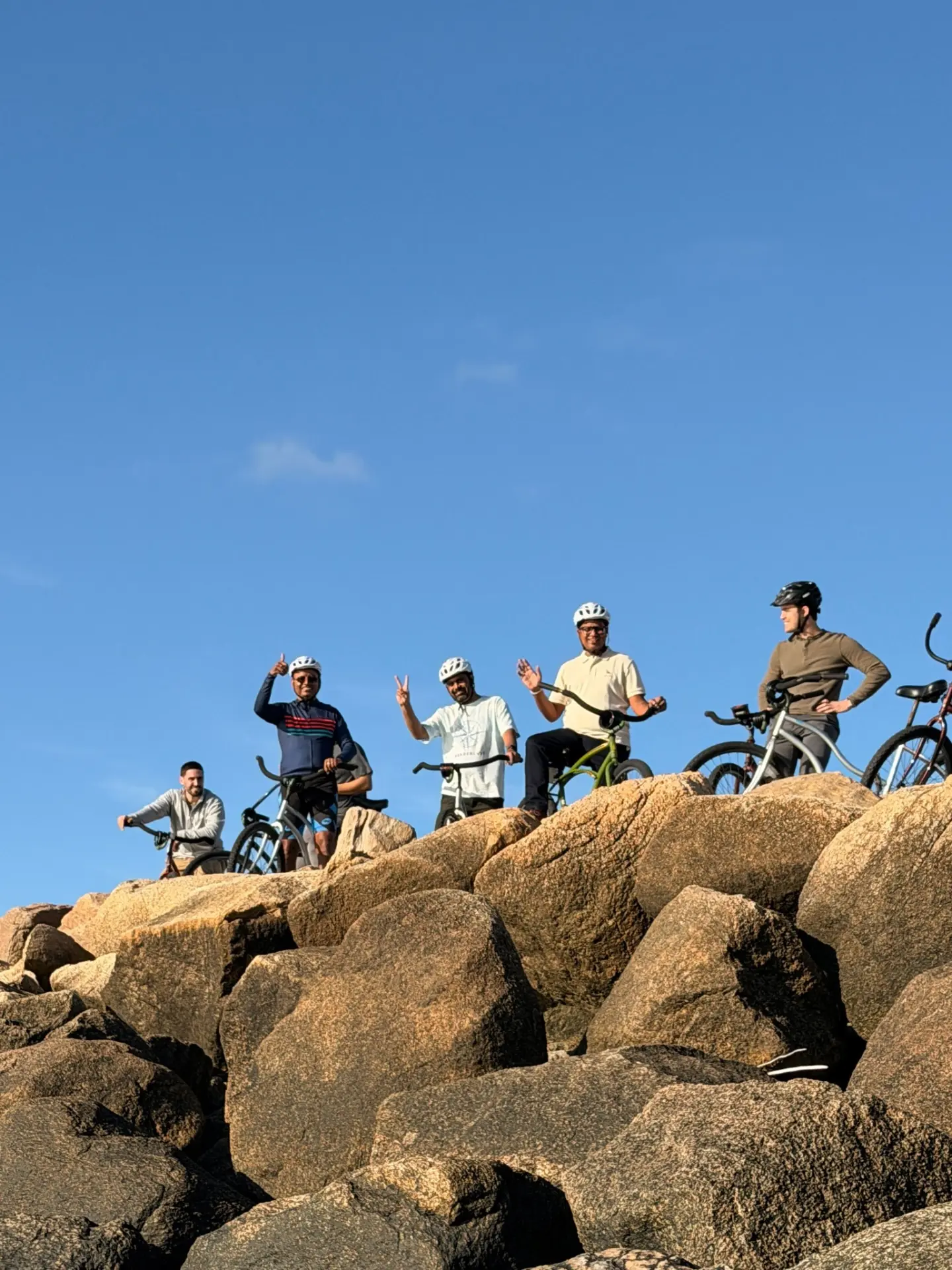 The team on a coastal bike ride during the offsite